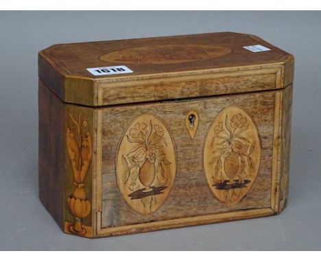A George III inlaid mahogany tea caddy, of canted rectangular form with twin lidded interior, 19cm wide x 13cm high, together