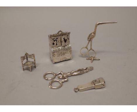 A Dutch silver model of a commode, import mark Sheffield 1894, a Dutch silver model of a corner chair, import mark Sheffield 