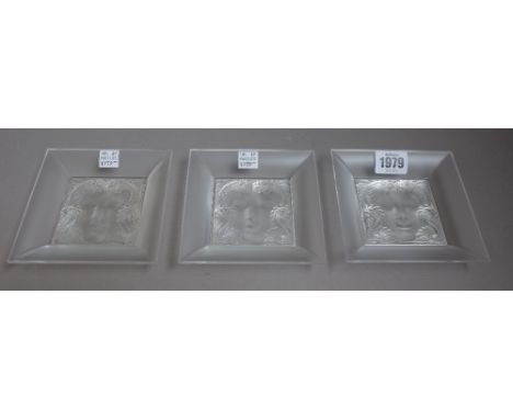Three modern Lalique square dishes, each relief moulded to the centre with a siren portrait with a mythological fish border, 