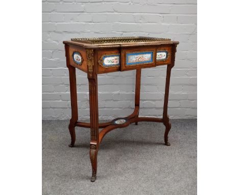 A late 19th century gilt metal and ceramic mounted Kingwood rectangular jardiniere, on tapering square supports united by 'X'