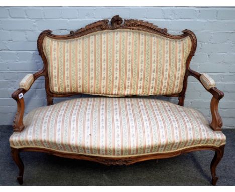 A Louis XV style stained beech open arm sofa with serpentine seat on scroll supports, 125cm wide x 97cm high.  