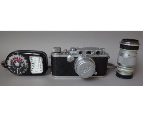 A Leica D.R.P. camera with Summar 5cm lens, an Elmar 9cm lens, a Leitz 9cm view finder and a Weston 'Master 3' light meter.  