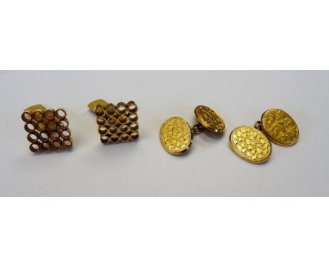 A pair of late Victorian 15ct gold cufflinks, the oval backs and fronts with foliate engraved decoration, Birmingham 1896, we