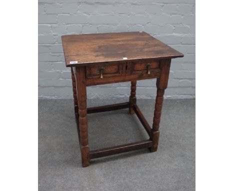 A Charles II and later oak side table with single raised moulded drawer on turned supports, 58cm wide x 66cm high. 