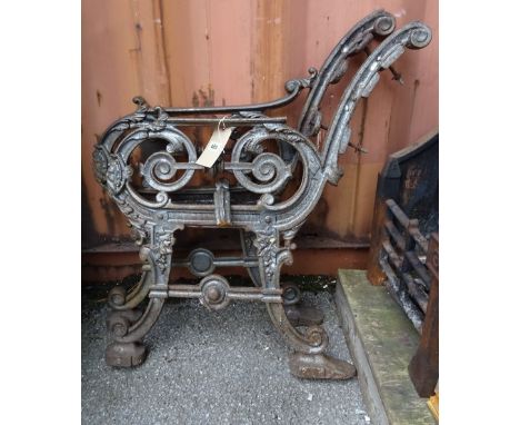 A pair of early 20th century cast iron bench ends, 80cm high, (2).