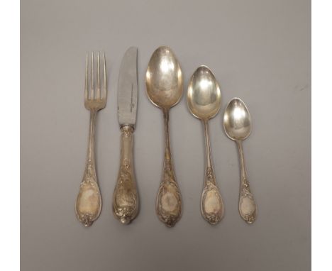 A German part table service of flatware, comprising; nine tablespoons, nine dessert spoons, seven table forks, eight teaspoon