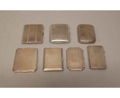 Silver, comprising; a rectangular cigarette case, the exterior with engine turned decoration, highlighted with gilt bands, Bi
