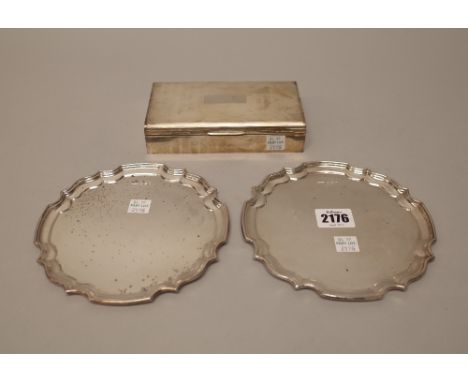 Silver, comprising; a pair of shaped circular card trays, having Chippendale style rims, diameter 15.5 cm, Sheffield 1973, co