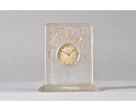 `Six Hirondelles Perchees', a Lalique glass clock, designed 1920, moulded in relief and sepia stained, etched mark, R Lalique