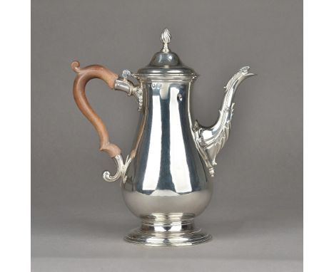 An early George III silver coffee pot, of baluster form, raised on a plain circular foot, the hinged lid with a wrythen knop 