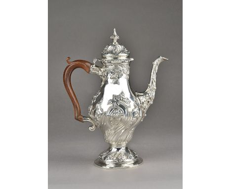 A late George II silver coffee pot, of baluster form, embossed with spiral foliate sprays within fluted divisions, the hinged