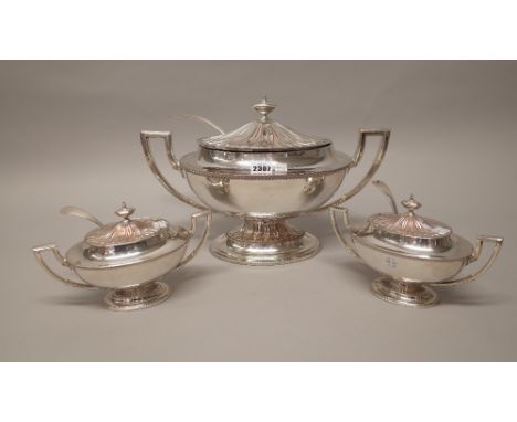 A plated on copper twin handled lidded soup tureen and a matching pair of smaller plated on copper twin handled lidded sauce 