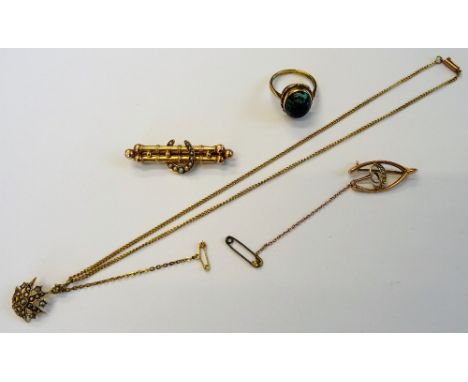 A gold ring, collet set with an oval wood opal, detailed 9 CT, ring size S, a gold and seed pearl set pendant, in a starburst