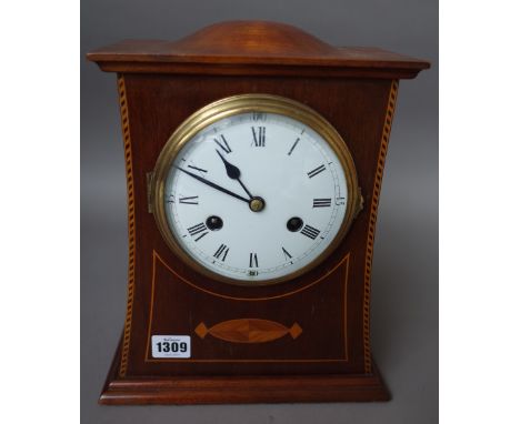 An Edwardian mahogany and inlaid mantel clock with domed top, five inch enamel dial and a two train movement, 30cm high, (key