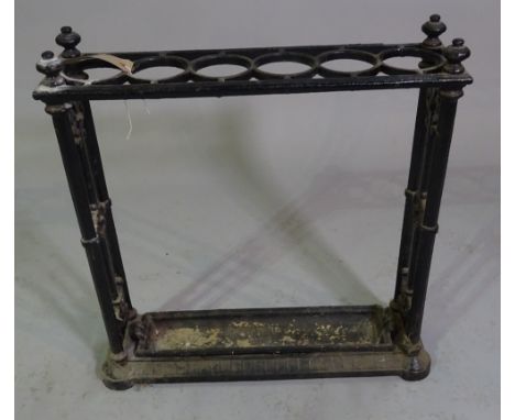 An early 20th century cast iron six division stick stand, 60cm wide x 64cm high. 