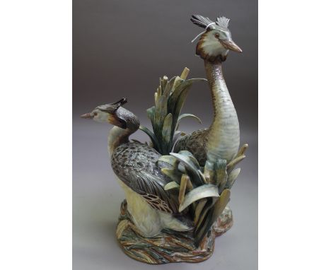 A Lladro Limited Edition ornithological group, circa 1974, modelled by Antonio Ballester as two Grebes amidst reeds guarding 