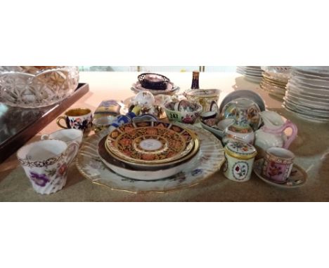 A group of English and Continental ceramics and enamels, to include; miniature cups and saucers; a Staffordshire dog whistle;
