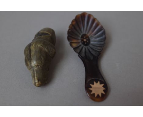 An early 20th century novelty horn whistle carved as a dog head, 5.5cm and an early Victorian tortoiseshell and gold inlaid t