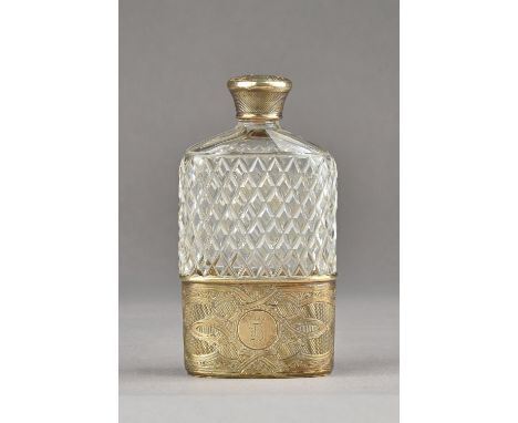 A Victorian silver gilt mounted faceted glass spirit flask, the glass body with cross hatched faceted decoration, the pull-of