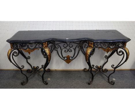 A 20th century French console table, the serpentine marble top over a polished steel and cast brass scroll base, 182cm wide x