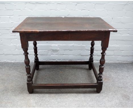 A 17th century oak rectangular side table on baluster supports, 86cm wide x 68cm high. 