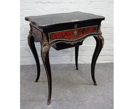 A 19th century gilt metal mounted ebonised boulle work lift top work table, with frieze drawer and wool box on cabriole suppo