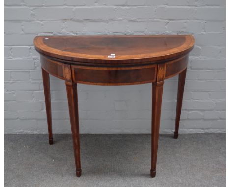 A George III satinwood banded mahogany demi-lune card table, on tapering square supports, 92cm wide x 75cm high.