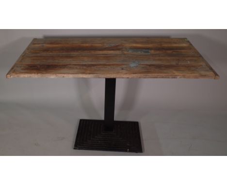 A 20th century stained pine rectangular dining table on black painted metal tiered base, 130cm wide x 80cm high, and a 20th c