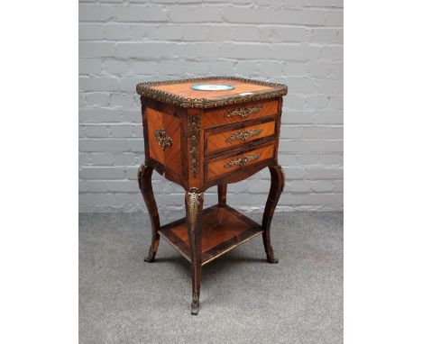 A late 19th century French gilt metal and ceramic mounted Kingwood and rosewood lift top work table, with a pair of frieze dr