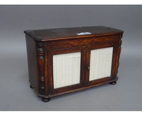 A 19th century diminutive mahogany Continental two drawer commode, with split column decoration, 34cm wide x 22cm high.