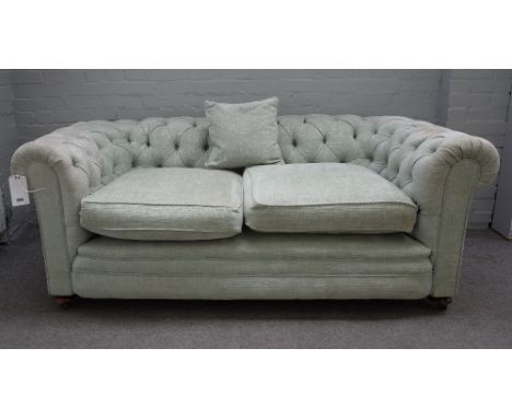 An early 20th century pale teal button back Chesterfield sofa, on bun feet, 190cm wide x 75cm high.