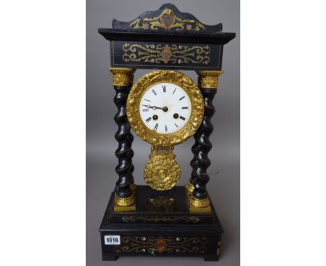 An ebonised portico mantel clock, 19th century, the drum within four barley twist supports, with a two train movement and bra