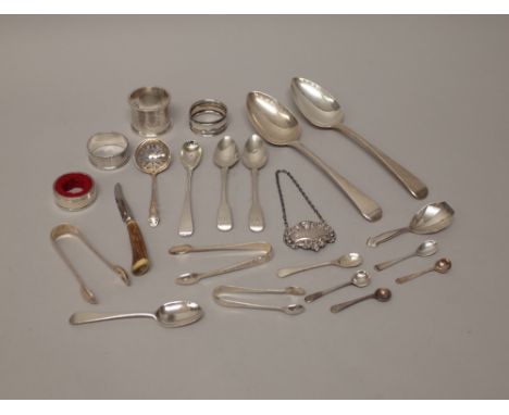 Silver, comprising; a pair of Old English pattern tablespoons, three napkin rings, a decanter collar drip catcher, three pair