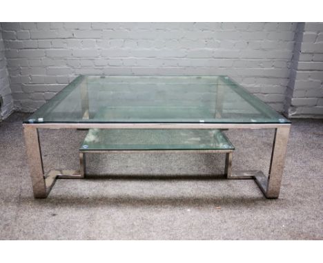 A 20th century square polished steel and glass two tier coffee table, 121cm wide x 41cm high. 