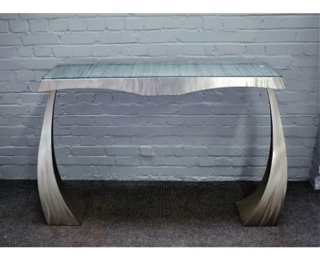 20th century design; a polished steel console table on shaped tapering square supports, 142cm wide x 92cm high.   