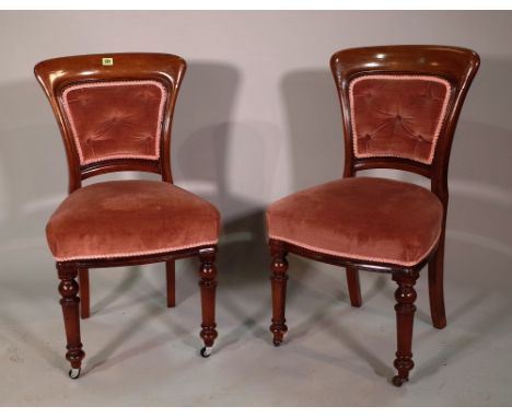 A set of six 19th century mahogany button upholstered dining chairs on turned supports, (6). 