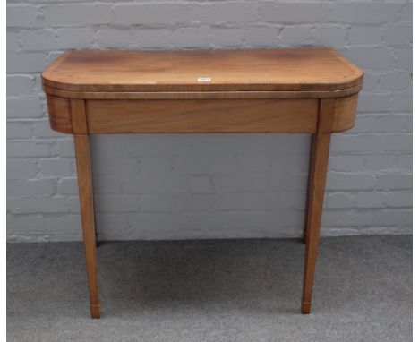 A George III crossbanded mahogany D shaped card table on tapering square supports, 88cm wide x 75cm high. 