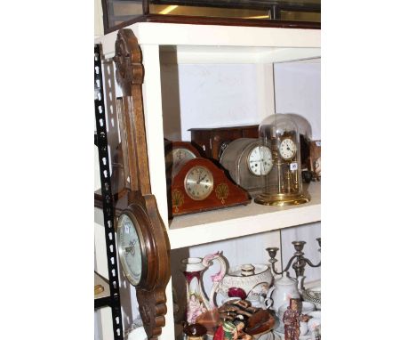 Collection of mantel clocks, barometer, carriage clock with dome and a wooden cabinet with drawers.