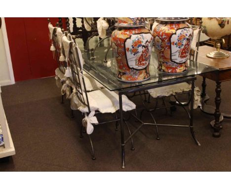 Rectangular glass topped dining table and eight chairs together with an antique single drawer side table.