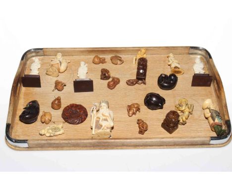 Collection of twenty six netsuke, small figures and wood carvings.
