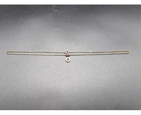 A yellow metal ruby and diamond necklace, stamped 18k, set two rubies and eight diamonds, 40cm. 