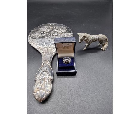 An Edwardian silver hand mirror,&nbsp;Birmingham 1906; together with a plated model of a fox; and a&nbsp;white metal ring, st