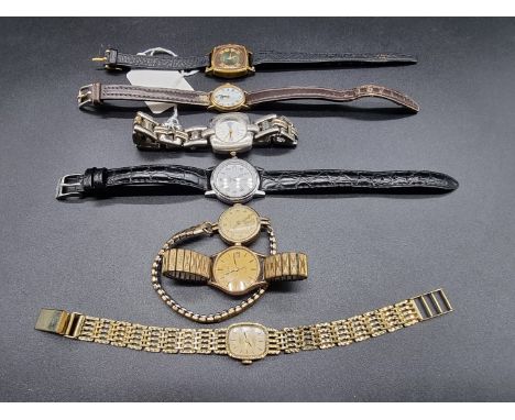 A Cyma 9ct gold manual wind ladies wristwatch,&nbsp;21mm, on gold plated expanding bracelet; together with six other ladies w