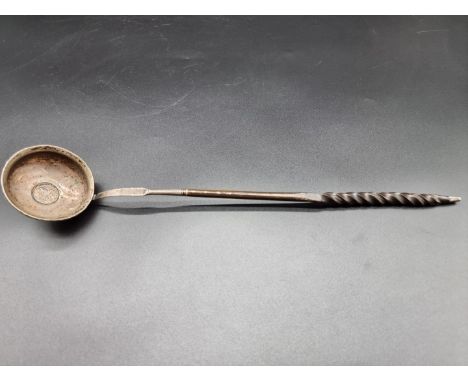 A Georgian silver and baleen&nbsp;toddy ladle, with coin inset bowl,&nbsp;34.5cm. 