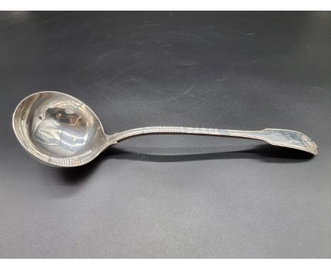 A George III silver fiddle thread and shell pattern soup ladle, by Eley, Fearn &amp; Chawner, London 1808, 33cm, 244g. 