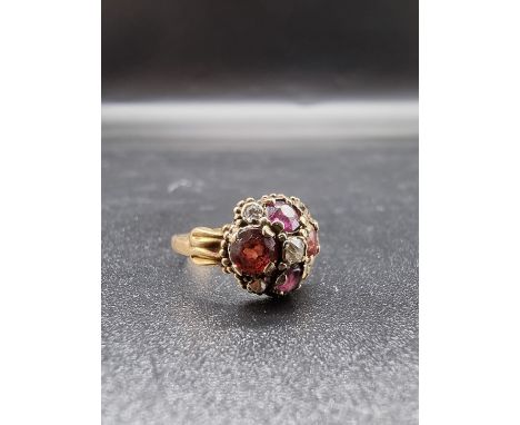 A Victorian yellow metal, diamond, ruby and topaz cluster ring, stamped 15, size G 1/2, gross weight 1.5g. 