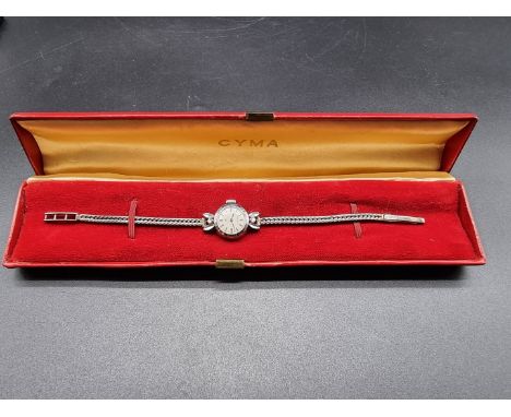 A cased c1960/70s Cyma Cymaflex manual wind ladies wristwatch,&nbsp;17mm, stamped 750/18k, set two brilliant cut diamonds, on