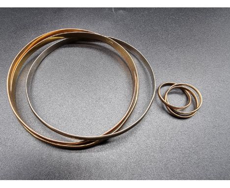 A 9ct gold three tone triptych bracelet, 83mm internal diameter; together with a similar ring, size J-K, 45g. 