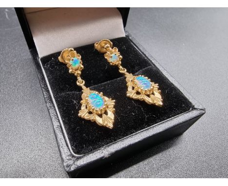 A pair of yellow metal and opal pendant earrings,&nbsp;stamped 14k, 3cm. 