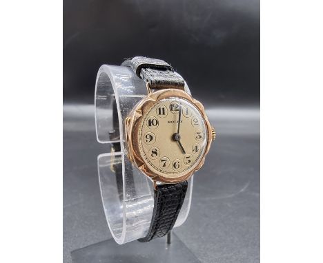 A 1940s Rolex manual wind ladies wristwatch, 26mm, with scalloped border, stamped 9c, serial No. 275002, on a replacement bla